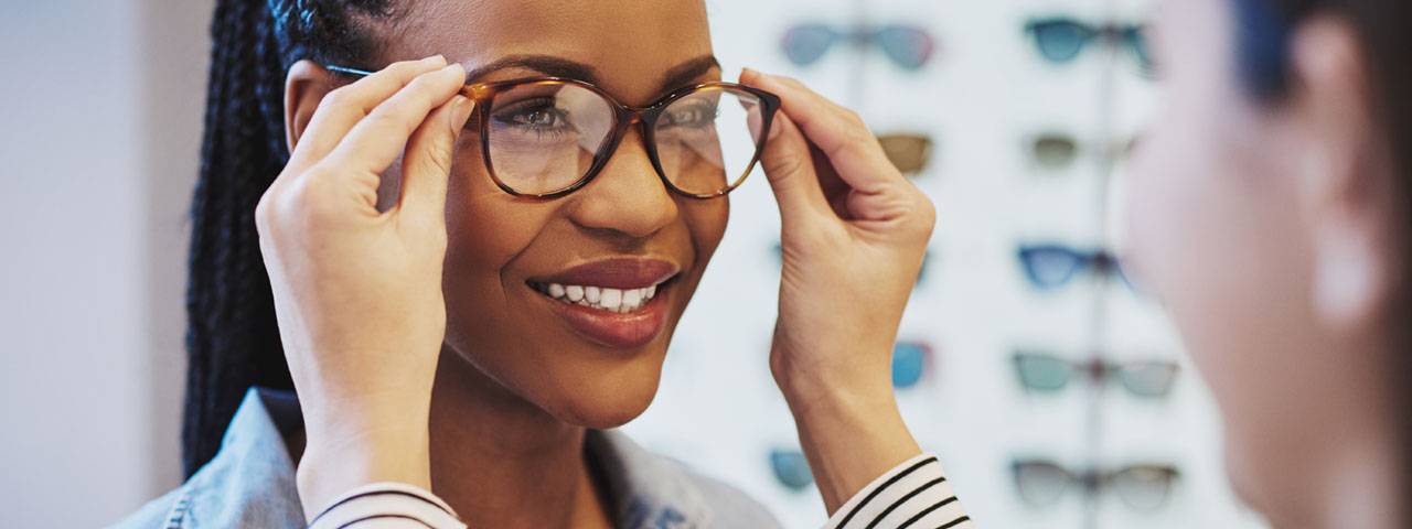 African Woman Trying on Glasses 1280x480